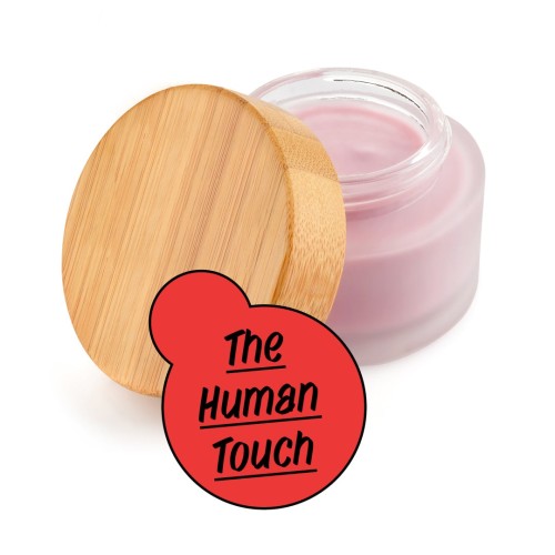 The Human Touch - The picture shows a glass with skin cream