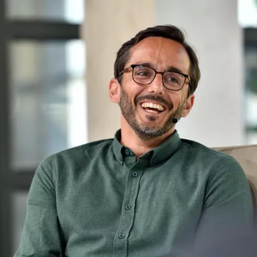 Man with glasses and green shirt 