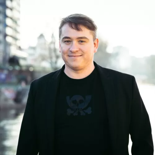 human smiling in front of danube river